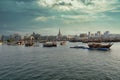 Doha corniche sunset shot taken from Arabic gulf with dhows old wooden boats with Qatar flag in water Royalty Free Stock Photo