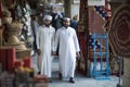 Qatari locals in traditional attire.