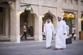 Qatari locals in traditional attire.