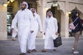 Qatari locals in traditional attire.