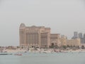 Doha / Qatar - April 10 2019: View of the St Regis Hotel on a hazy day Royalty Free Stock Photo