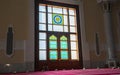 Sun light coming through the colorful stained glass window of a mosque Royalty Free Stock Photo