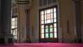 Sun light coming through the colorful stained glass window of a mosque Royalty Free Stock Photo