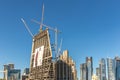 Doha, Qatar - Jan 8th 2018 - Moderns buildings under construction in downtown Doha in a blue sky day in Qatar.