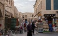 Merchants and tourists in a small arabian street in Souq Waqif, old town, Qatar