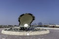 Qatar, Doha, Pearl Oyster Monument with its fountain at the northern end of the Corniche. Royalty Free Stock Photo