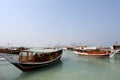 Traditional dhows moored up along the corniche in the Qatari capital Doha, with the skyscrapers