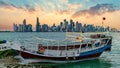 Doha Qatar skyline with traditional Qatari Dhow boat in the harbor, Qatar Royalty Free Stock Photo