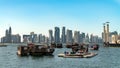 Doha Qatar skyline with traditional Qatari Dhow boats in the harbor Royalty Free Stock Photo