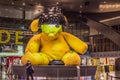 31.05.2021, Doha, Qatar: Yellow lamp teddy bear sculpture in the middle of the terminal at the Hamad International