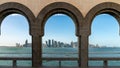 Doha skyline through the arches of the Museum of Islamic art, Doha, Qatar Royalty Free Stock Photo