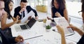 Doing a bit of strategizing. Cropped shot of a group of businesspeople sitting around the boardroom table during a Royalty Free Stock Photo