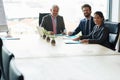 Doing business is in our blood. a group of executives having a meeting in a boardroom. Royalty Free Stock Photo