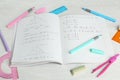 Doing homework. Notebook with math assignment and stationery on white desk, closeup Royalty Free Stock Photo