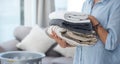 Doing laundry is soothing to me. an anonymous woman holding a pile of clean neatly folded laundry. Royalty Free Stock Photo