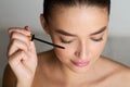 Doing Makeup. Woman Applying Mascara on Eyelashes Royalty Free Stock Photo
