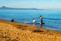 Doing paddle surfing in family with a small child