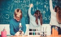 Doing research. Little kids learning chemistry in school lab. Little children at laboratory. Chemistry microscope Royalty Free Stock Photo