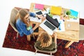 Doing some cramming in the quad. High angle shot of two female university students working on a project together at a Royalty Free Stock Photo