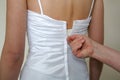 Doing up the brides dress Royalty Free Stock Photo