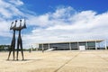 Dois Candangos Monument and Planalto Palace Building in Brasilia, Brazil Royalty Free Stock Photo