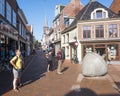 People on the streets of city centre in old frisian town of dokkum on sunny summer day Royalty Free Stock Photo