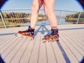 Man roller skater in speed hard shell skates. Man try trick on the pathway Royalty Free Stock Photo