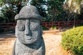 Dol hareubang stone grandpa sculpture at Daepo Jusangjeolli park in Jeju Island, Korea Royalty Free Stock Photo