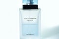 Dolce & Gabbana perfume bottle on white background, light blue parfum.