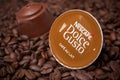 Dolce gusto nescafe expresso coffee capsules on coffee beans background