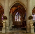 View of the altar and stained glass windows of a side chapel inside the Collegiale Notre Dame church in Dole Royalty Free Stock Photo