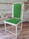 Doll chair with soft green upholstery