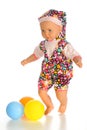 A doll cute little girl in colorful clothes with colorfull balloons