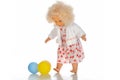 A doll cute little girl in colorful clothes with colorfull balloons