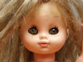 A doll with disheveled hair and rusty eyeballs. Close-up. Photo for the holiday of Halloween Royalty Free Stock Photo