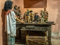 Doll in front of religious statues, Finca La Azotea, La Antigua, Guatemala Royalty Free Stock Photo