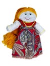 Doll-girl with yellow hair, made of cloth, in a red dress. Home creativity. Traditional Russian doll. Isolated doll on a
