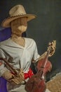 Doll holding violin closeup, Finca La Azotea, La Antigua, Guatemala Royalty Free Stock Photo