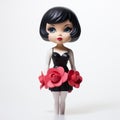 Cartoonish Rose Figurine With Black Hair And Dress