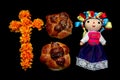 Colorful handmade cloth doll with pan de muerto from the town with sesame in the offering for the Day of the All Souls and All Sai