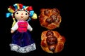 Colorful handmade cloth doll with pan de muerto from the town with sesame in the offering for the Day of the All Souls and All Sai