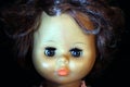 Doll portrait on a black background. Royalty Free Stock Photo