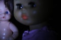 Doll portrait on a black background. Royalty Free Stock Photo