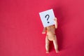 Doll with question mark Royalty Free Stock Photo