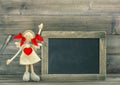 Doll with Red Heart. Valentines Day decoration with blackboard