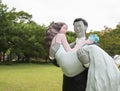 Doll sculpture - Bride and Groom in outdoor garden