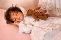 Doll Sleeping with Teddy Bear Royalty Free Stock Photo