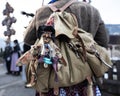 A doll on a witch& x27;s backpack during the annual perchten procession in the Austrian Gastein Valley Royalty Free Stock Photo