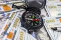dollar banknotes with compass. close up. Royalty Free Stock Photo