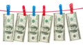 Dollar banknotes hanging on laundry line attached with plastic c Royalty Free Stock Photo